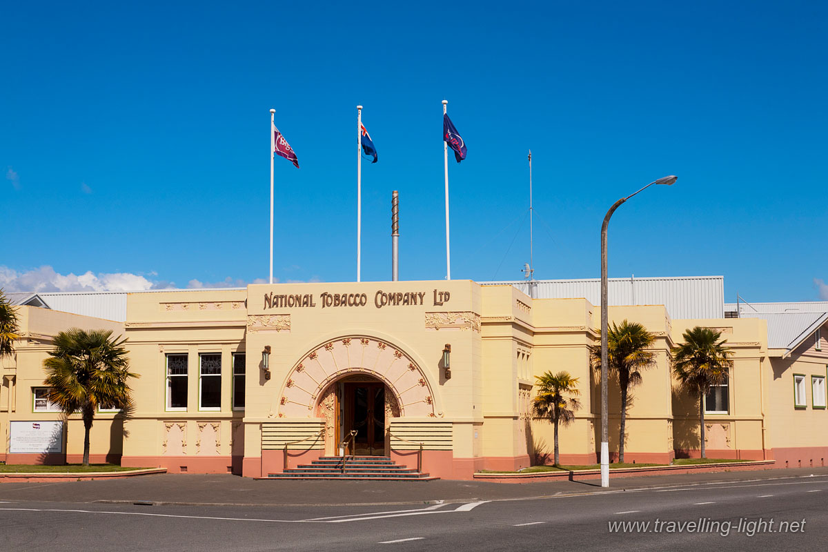 National Tobacco Company, Napier, Hawke's Bay
Famous Art Deco building in Napier, built after the 1931 earthquake levelled the city, which was then rebuilt in the Art Deco style. 
Keywords: Architecture;Napier;National Tobacco Company;New Zealand;Places;art deco;building;colour;copy space;flags;horizontal;landmark;palm trees